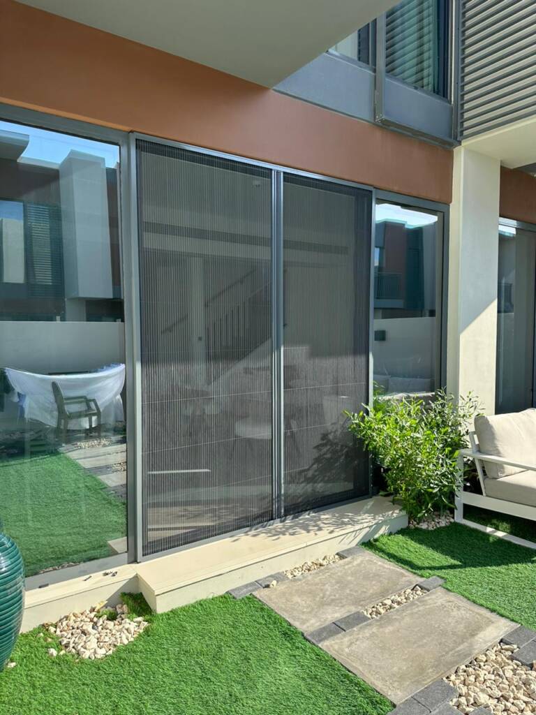 a picture of double fly screen services in dubai placed at a house.