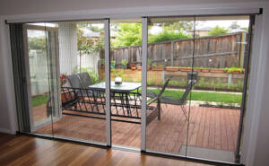 a picture of sliding fly screen services in dubai for windows and doors.