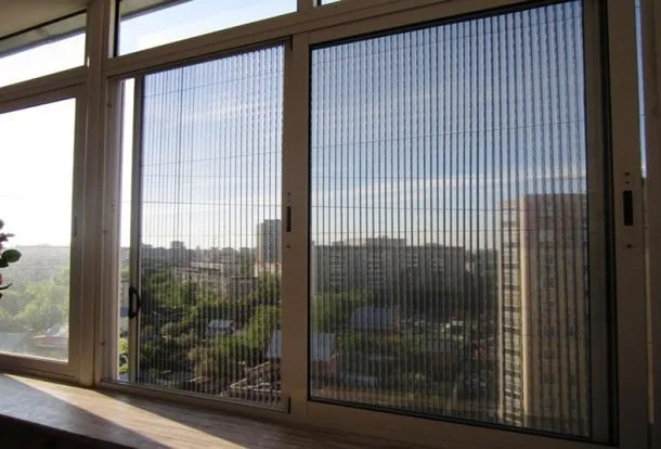 Retractable mosquito net mesh installed on a balcony door in Dubai