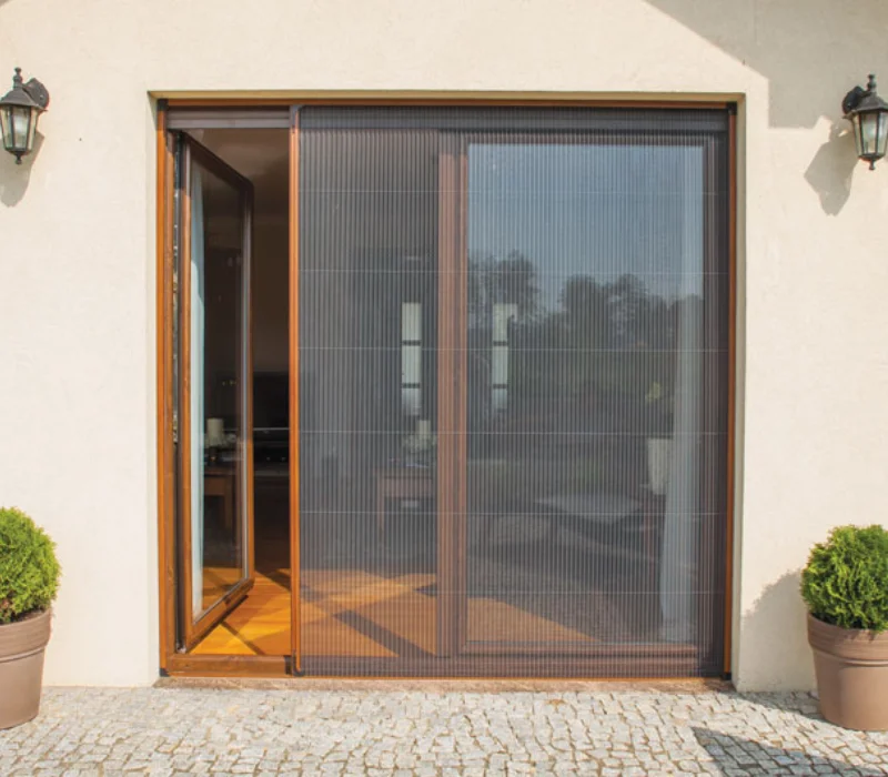 Pleated retractable fly screen fitted across a wide double doorway on a Dubai villa