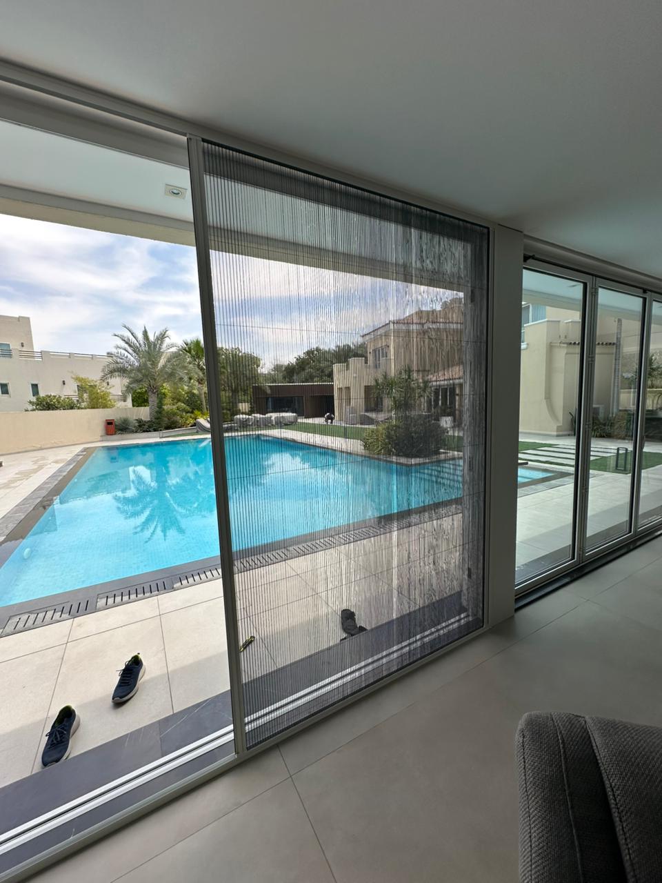 Extra wide fly screen for large patio opening at Dubai South lake villa with garden view