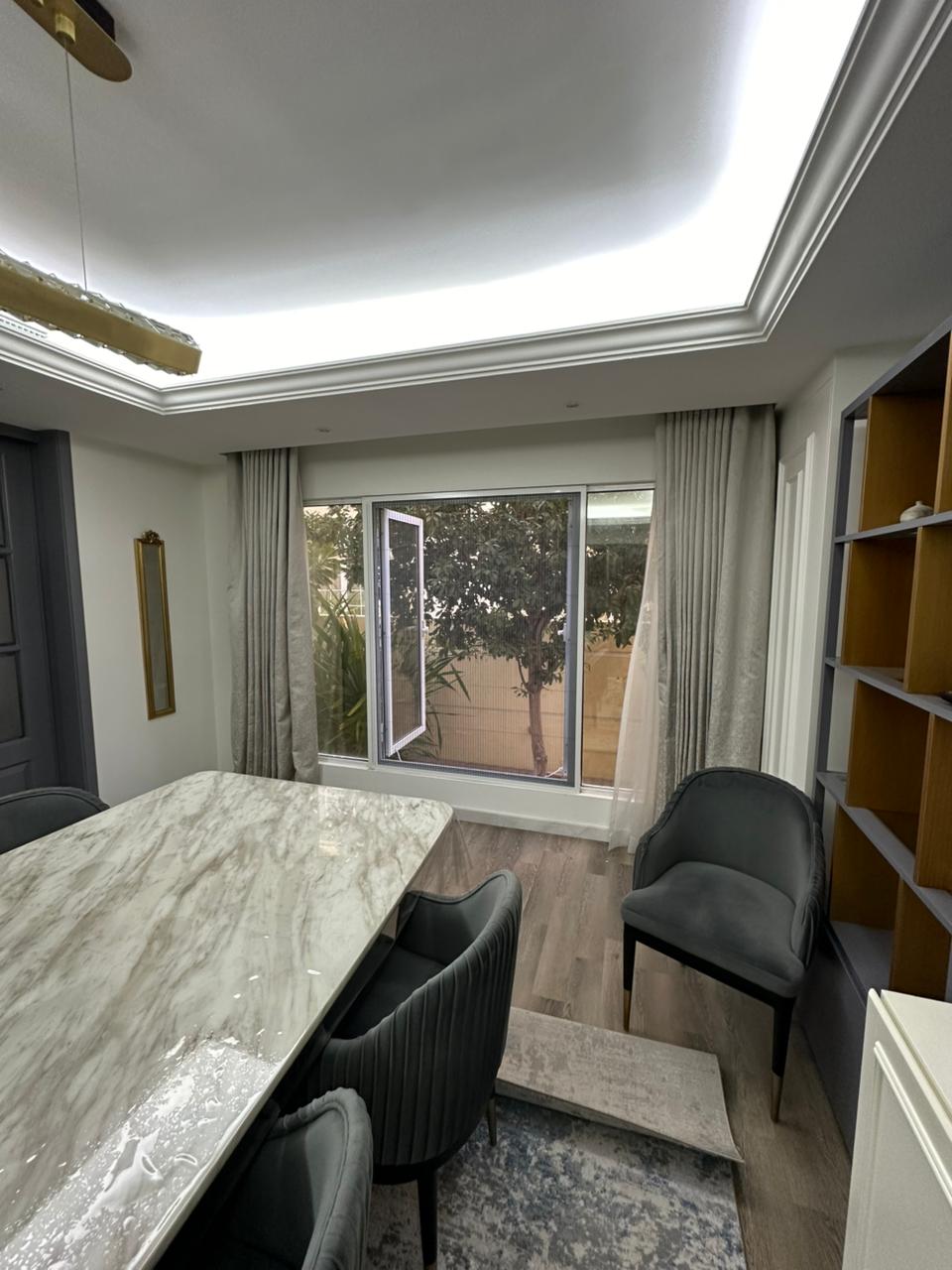 Fly screen installed on sliding window in Dubai apartment with independent panel operation