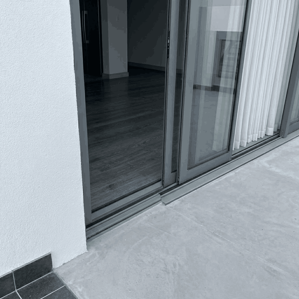 Retractable pleated single fly screen partially open showing mesh sliding into cassette in Dubai home