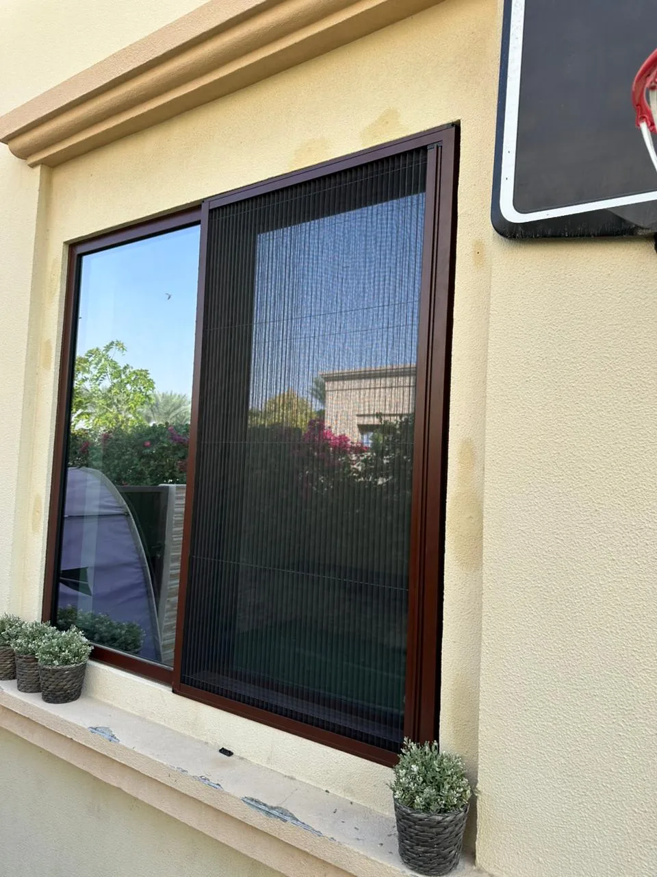 Window fly screen with fine mosquito mesh in a Dubai property